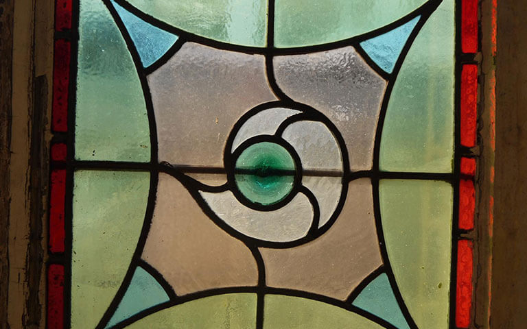 A photo of antique glass in a vintage piece sold by Cota Street antiques.