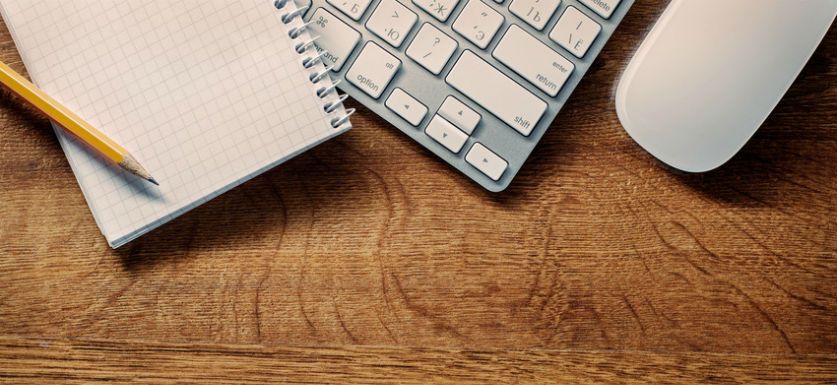 bookkeeping vs. accounting picture of office supplies on desk