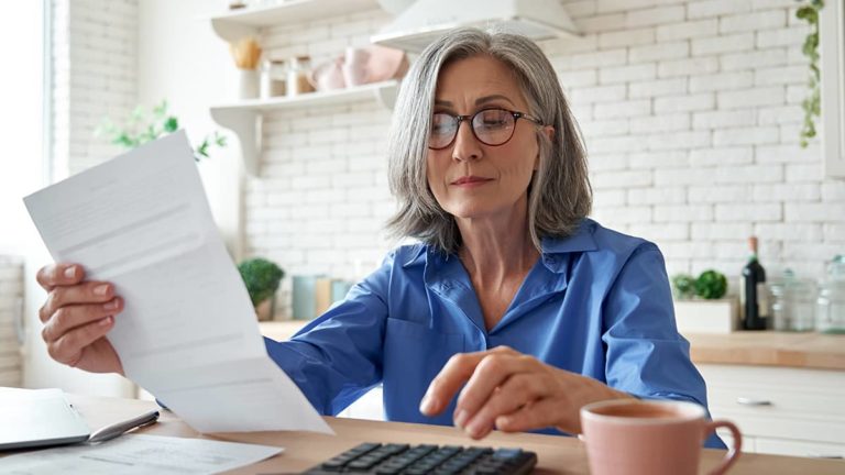 business owner reviewing tax information and going through paperwork